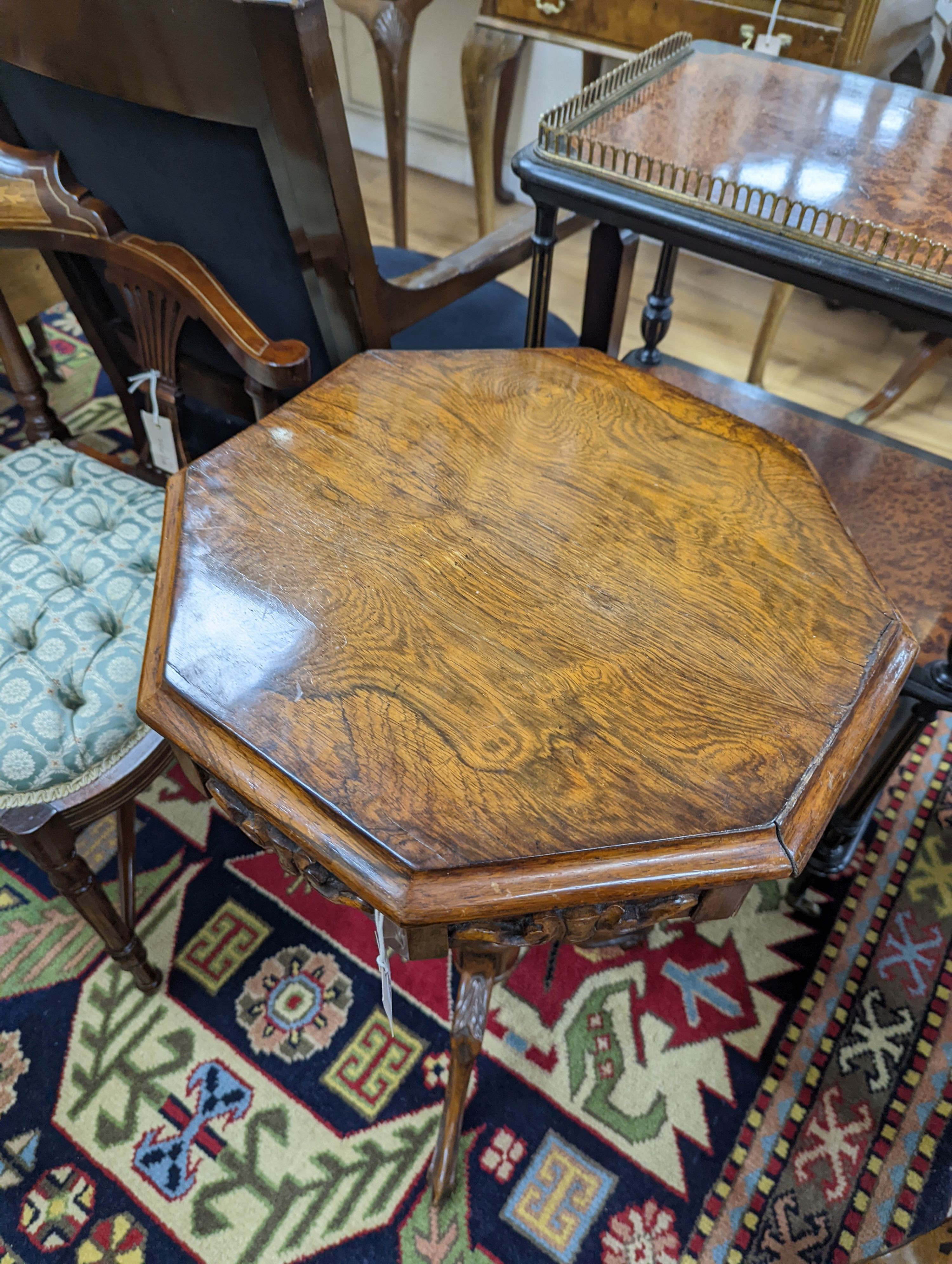 A Victorian octagonal walnut trumpet work table, width 42cm, height 73cm